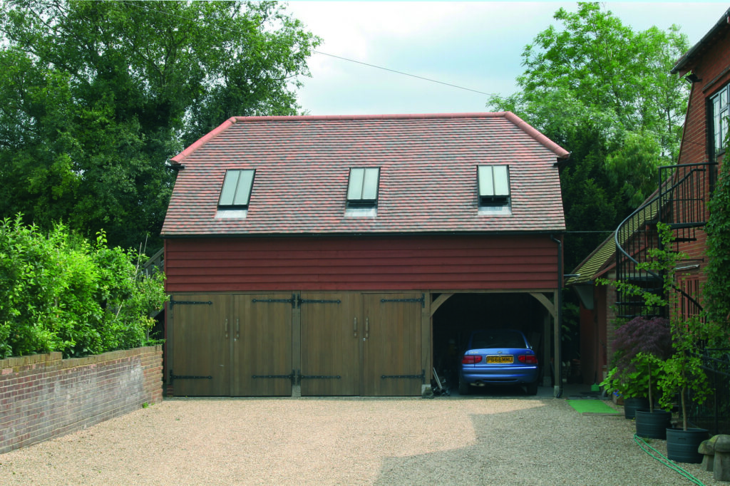 Three bay garage with room above