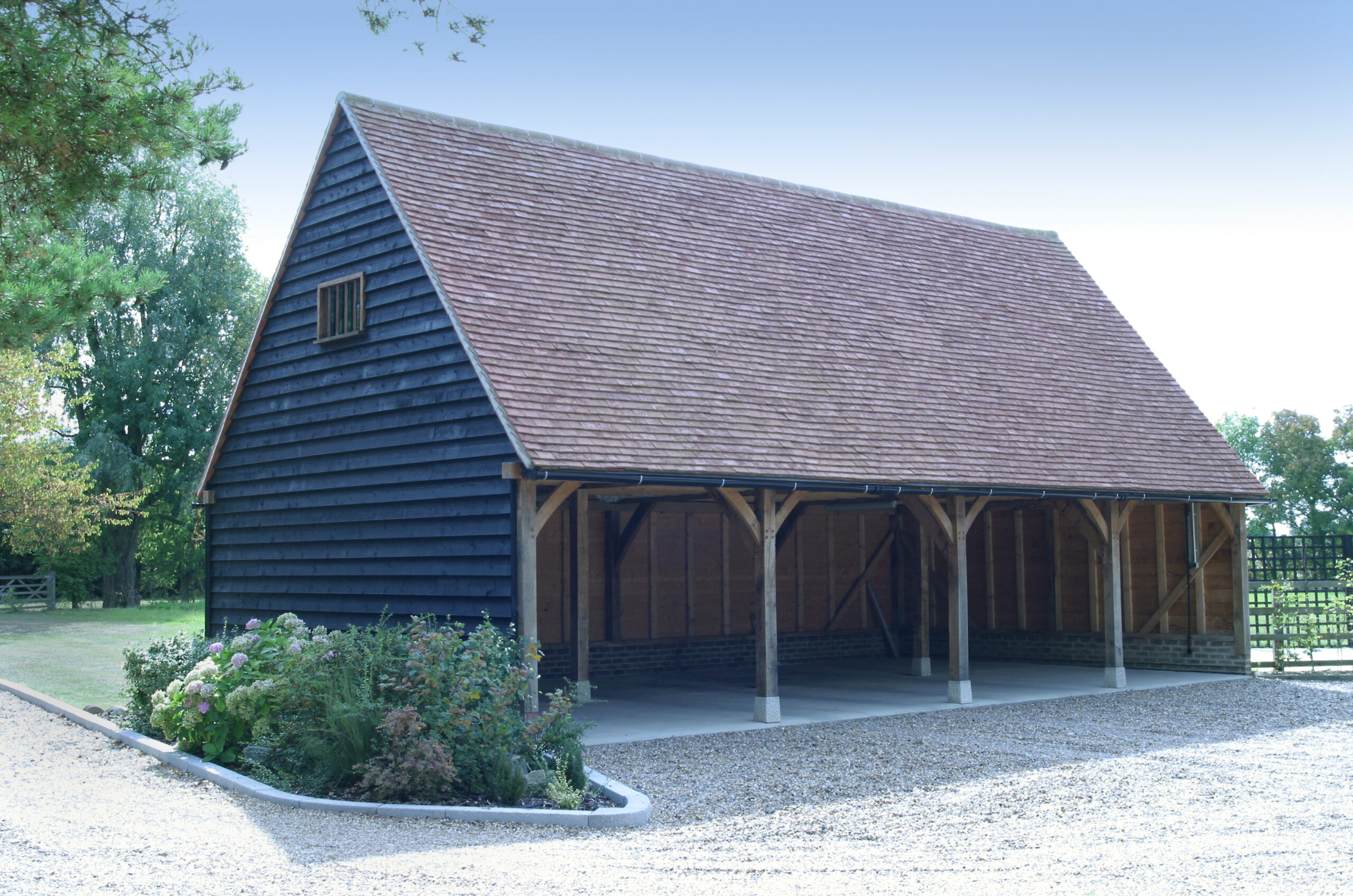 Bespoke Oak-Framed Buildings vs Off-the-Shelf 3 open 4 bay oak frame garage with first floor
